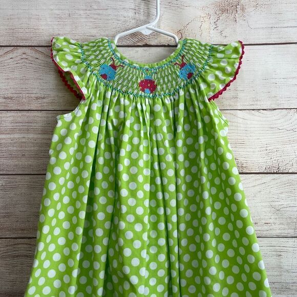 STITCHED AND SMOCKED GREEN AND WHITE POLKA DOT DRESS WITH EMBROIDERED LADYBUGS - Picture 2 of 9